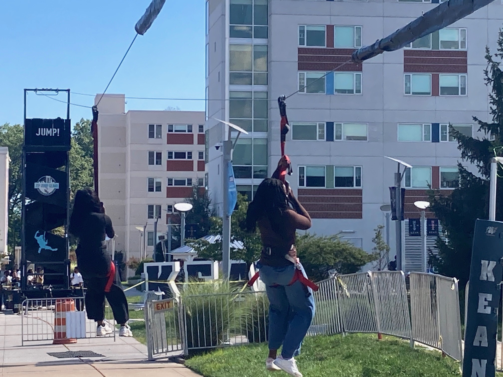 Two riders on the mobile zip line