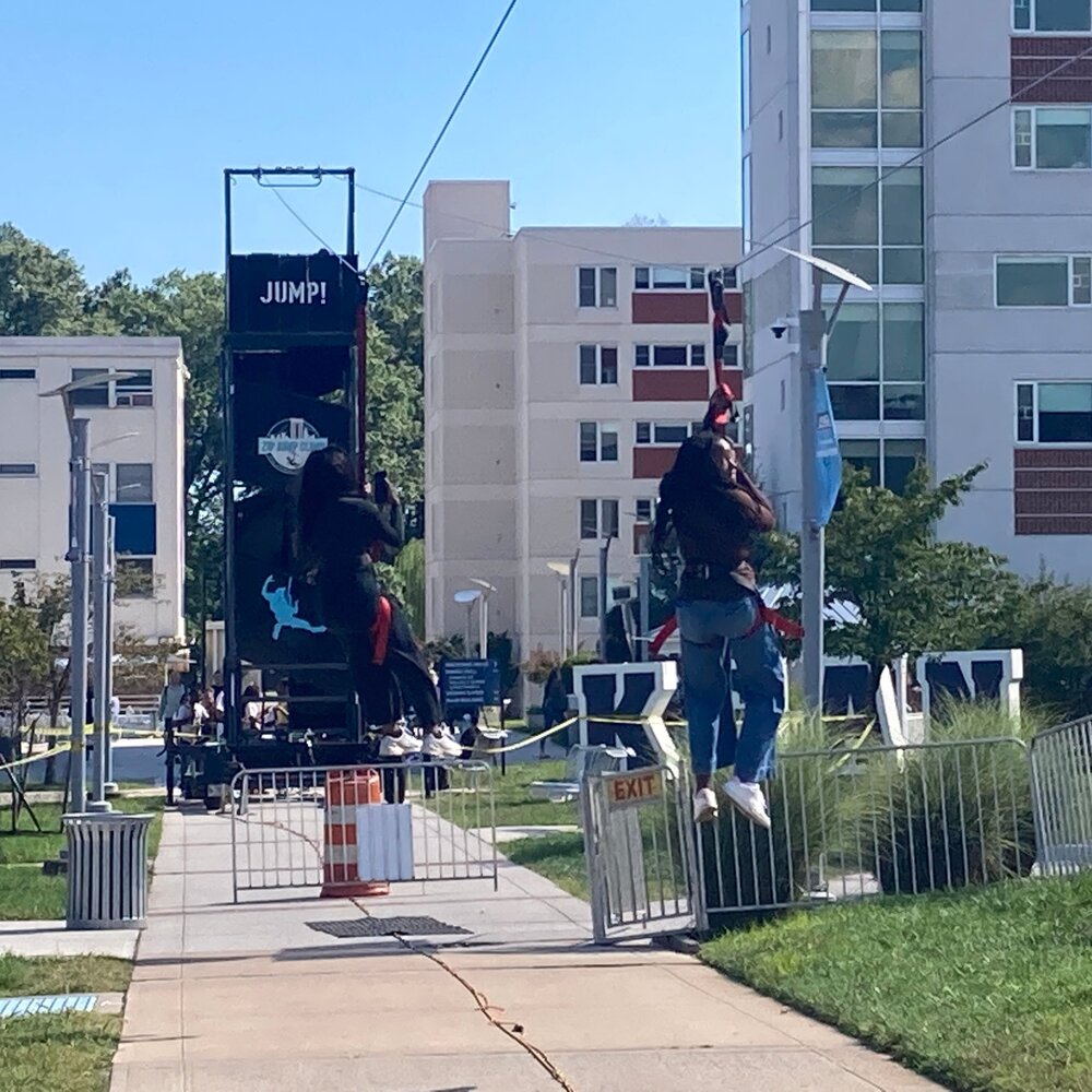 Rider on the mobile zipline at an outdoor event